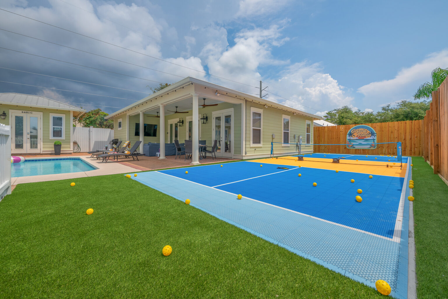Crystal Haven backyard with the private pool and pickleball court