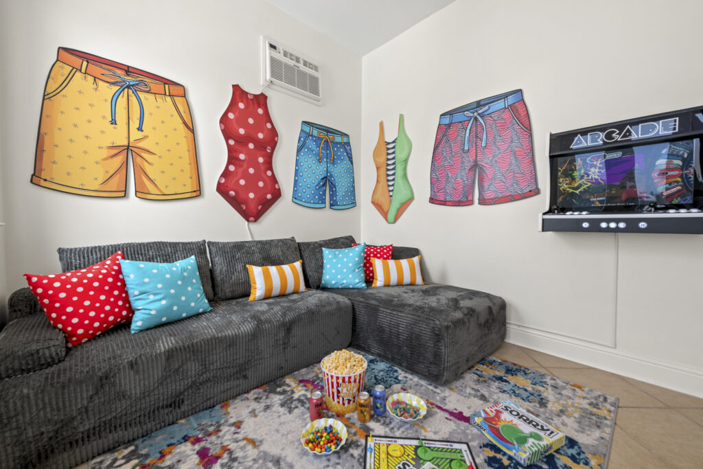 Pool house living room with sectional and TV